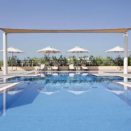 Moevenpick Hotel Apartments Al Mamzar Dubai Luaran gambar The swimming pool at the hotel
