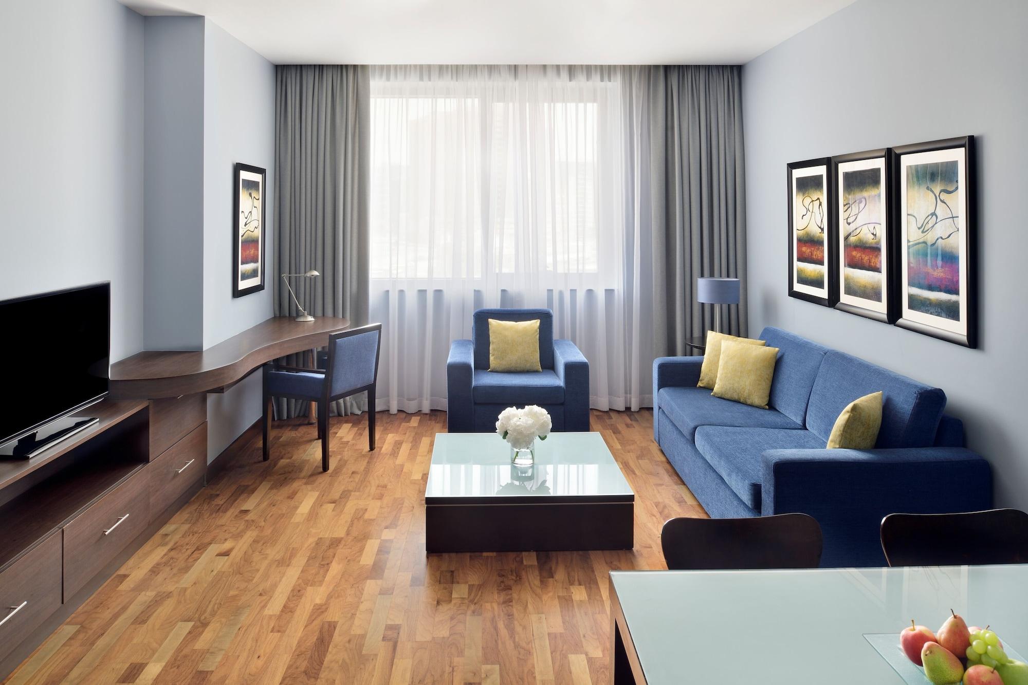 Moevenpick Hotel Apartments Al Mamzar Dubai Luaran gambar A typical living room