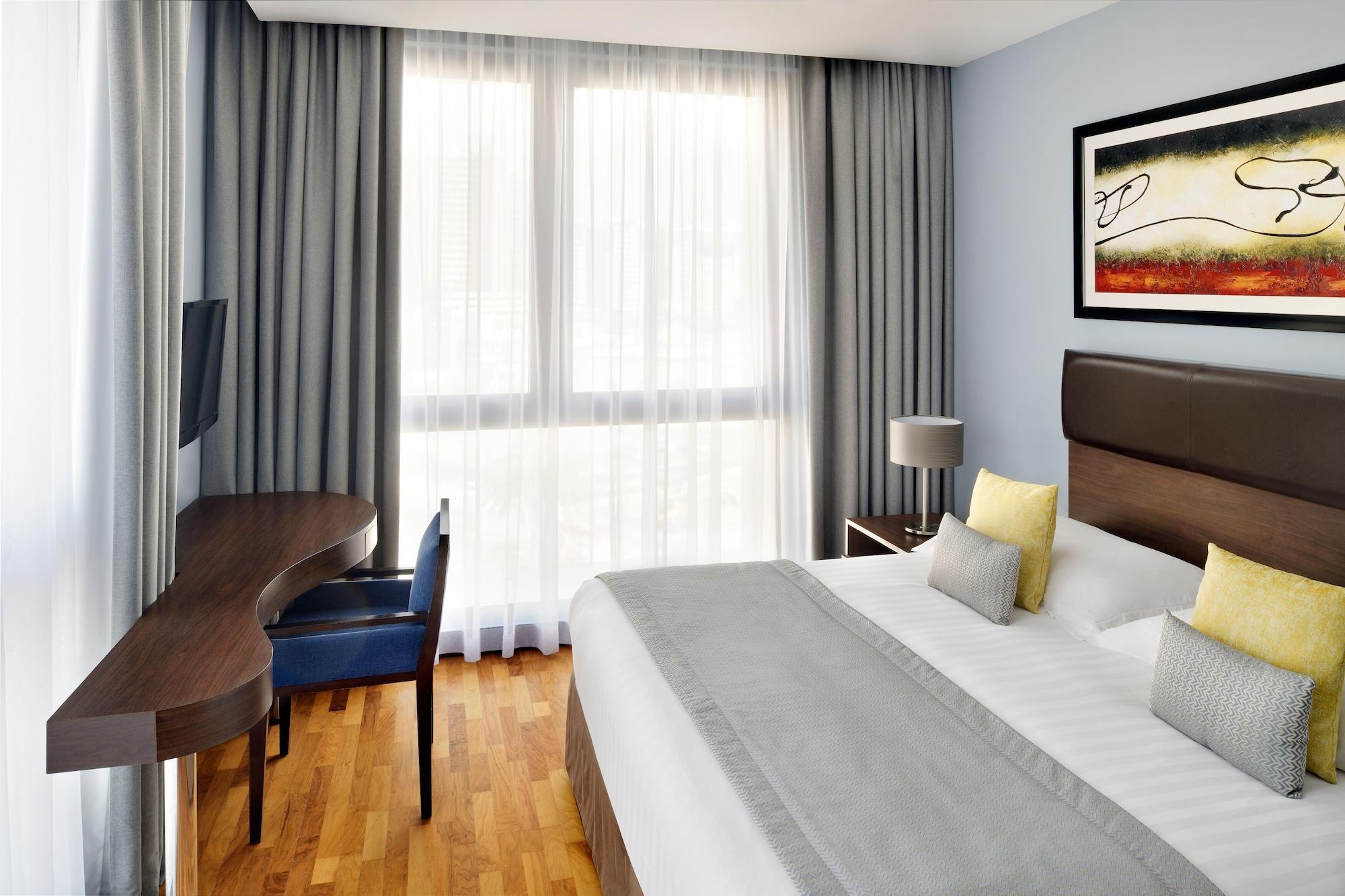 Moevenpick Hotel Apartments Al Mamzar Dubai Luaran gambar A typical room at the hotel
