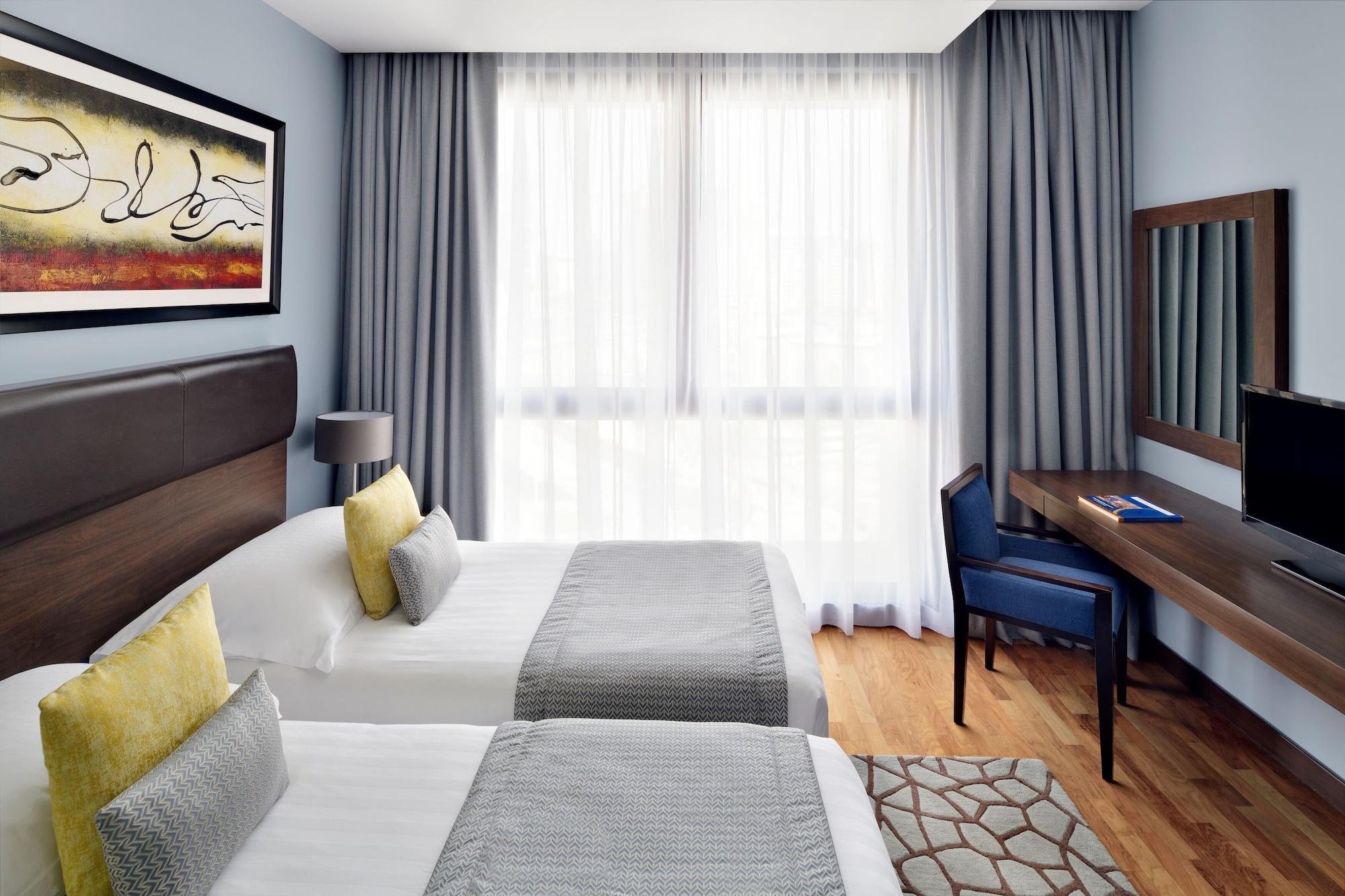 Moevenpick Hotel Apartments Al Mamzar Dubai Luaran gambar A room at the hotel