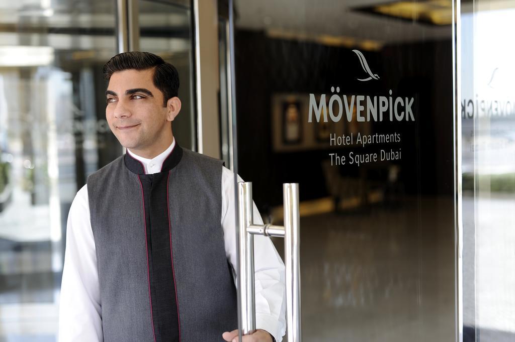 Moevenpick Hotel Apartments Al Mamzar Dubai Luaran gambar A doorman at a hotel in Dubai